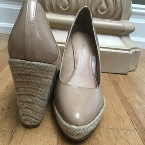 Leg-lengthening nude patent wedges (Bloomingdales)